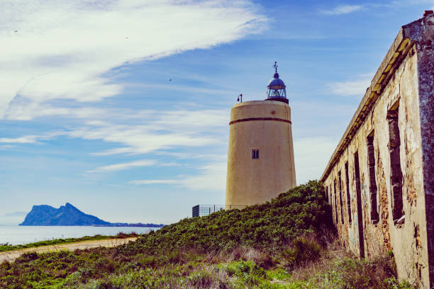 istock Lighthouse and Gibraltar rock, La Alcaidesa, Spain. 1443950372