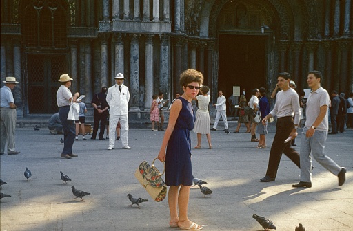 Venice, Veneto, Italy, 1965. Venetians and tourists in St. Mark's Square in front of the Cathedral.