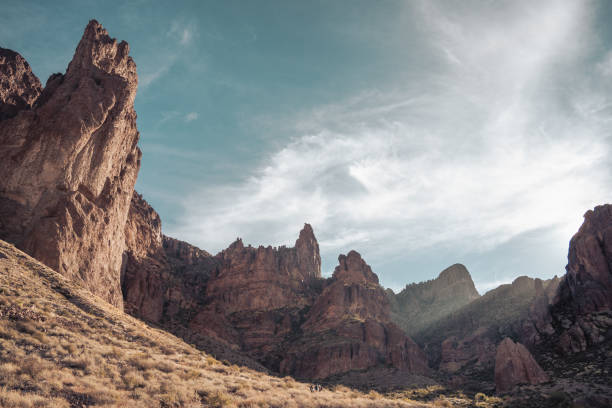 Sunrise over the Superstition Mountains from Lost Dutchman State Park with illuminated flat iron
