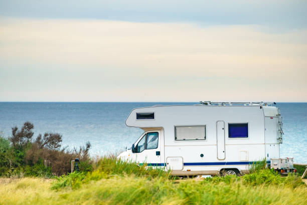 istock Camper on beach seashore. Holidays trip. 1443952985
