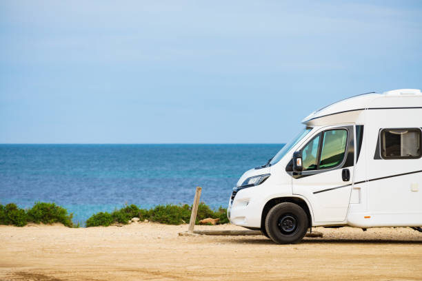 istock Camper on beach seashore. Holidays trip. 1443953133