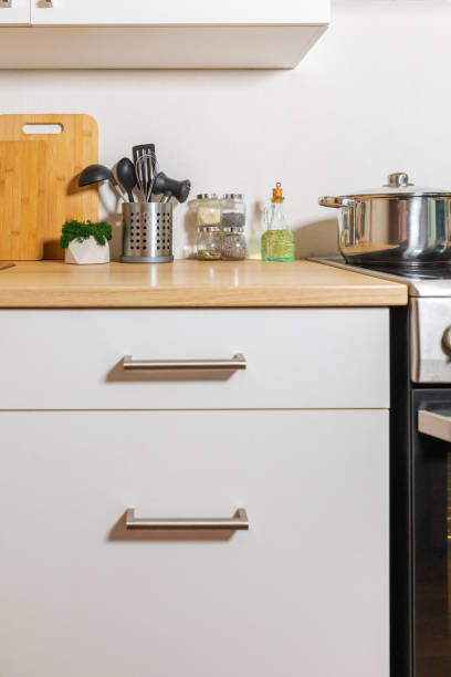 istock Scandinavian classic minimalistic kitchen with white and wooden details. Modern white kitchen clean contemporary style interior design. 1443953230