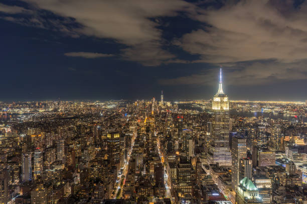 Iconic View of NYC skyline at night captured from a residential skyscraper in downtown NYC