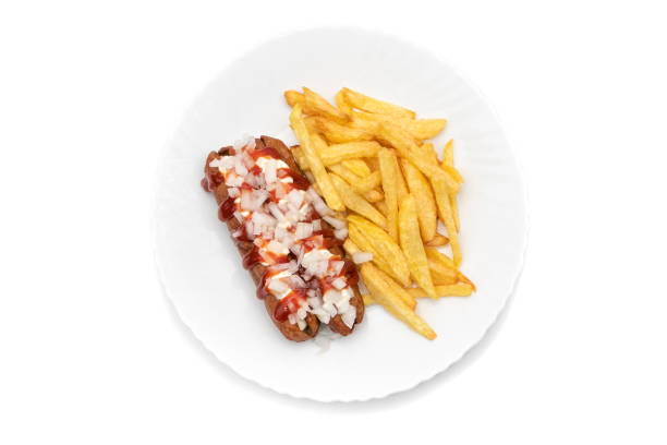 Frikadel with ketchup, mayonnaise on chopped onions, a Dutch fast food snack called "frikadel special", with pommes frites. Frikadel with ketchup, mayonnaise on chopped onions, a Dutch fast food snack called "frikadel special", with pommes frites. Isolated on white background. Dutch food concept. frikandel speciaal stock pictures, royalty-free photos & images