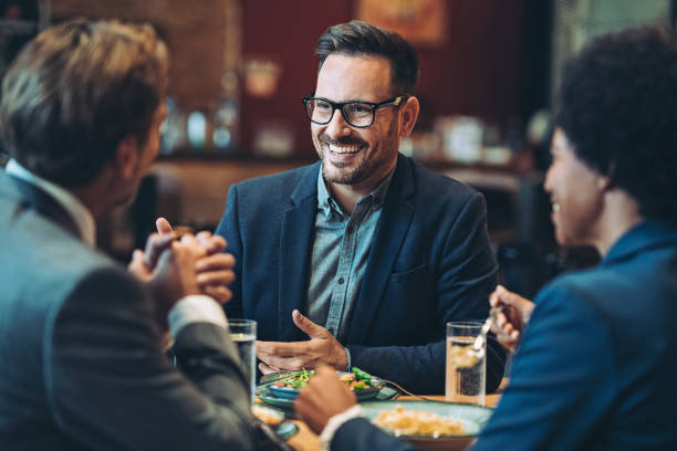 istock Smiling businessman in a conversation with colleagues 1443956214
