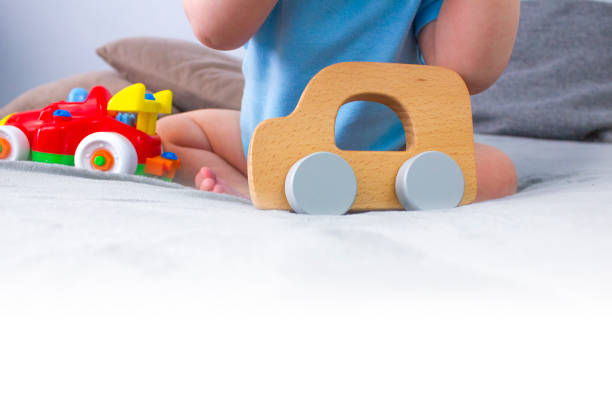istock A child plays with toys on the sofa. Copy space. 1443957576