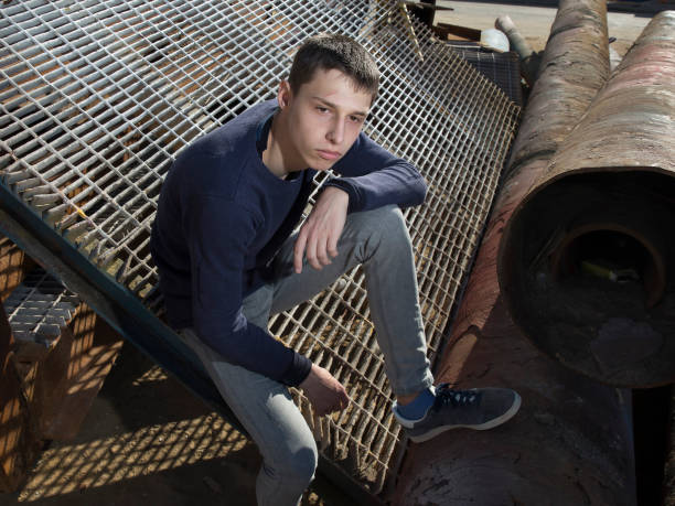 istock young caucasian handsome guy posing in industrial area 1443959389