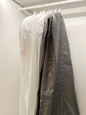 Garments hanging in the wardrobe closet