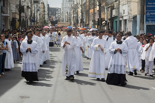 Salvador, Bahia, Brazil - May 26, 2016: Catholic priests and seminarians participate in the Corpus Christ procession in Salvador, Bahia.