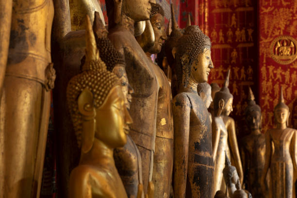 Ancient Buddha statues, Wat Xieng Thong temple, in Luang Prabang, Laos