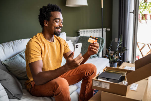 istock Young man using smart phone to shop online 1443965624