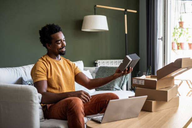 istock Satisfied young man loving a thing he bought online 1443966314