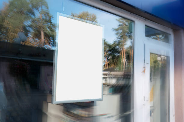 istock Blank vertical banner mounted behind window of urban pharmacy. 1443968289