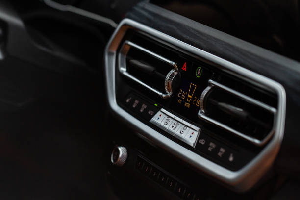 istock Digital control panel car air conditioner dashboard. Modern car interior conditioning buttons inside a car close up view. 1443973180