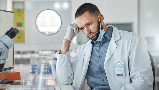 istock Science, research and covid with a confused man engineer working on innovation in his laboratory. Thinking, analytics and development with a male scientist at work in his medical lab on breakthrough 1443973262