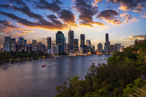 Dramatic sunset over Brisbane skyline and Brisbane river from Kangaroo Point Cliffs, Queensland, Australia.