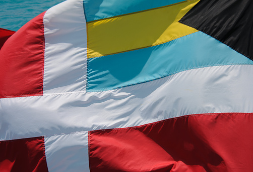 Colorful Courtesy flag of the Commonwealth of the Bahamas flying on a ferry boat in Bermuda