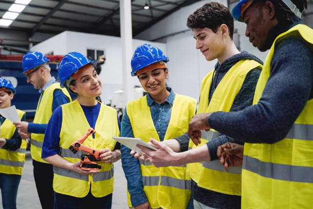 istock Multiracial engineers working inside automation and robotics facility - New industrial technology concept - Focus on young man eye 1443979356
