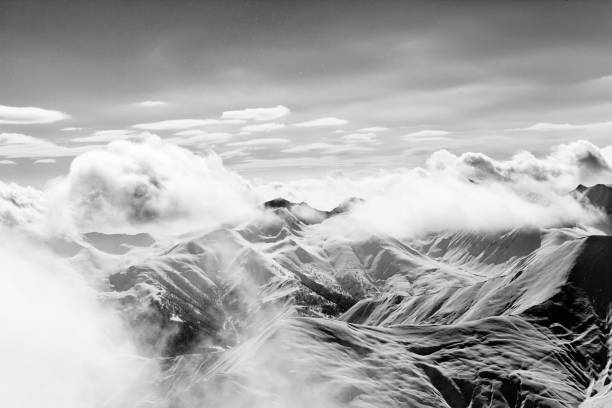 Free picture: Snowy mountain peak in clouds contrast monochrome photo