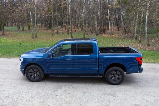 Berlin, Germany - 18th November, 2022: Electric pick-up Ford F-150 Lightning parked on a road. This model is the first mass-produced zero-emission pick-up from Ford.