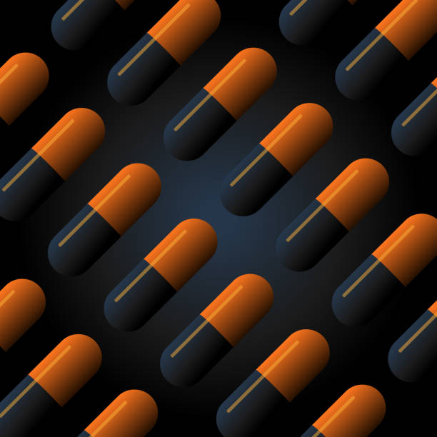 istock vector illustration of black and orange medicine pills lined up on black background 1443989326