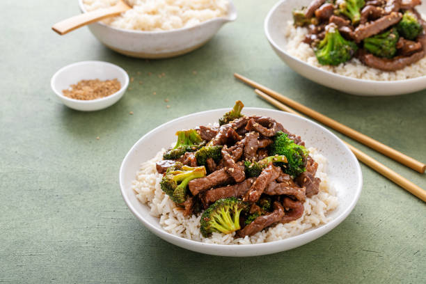 istock Beef and broccoli stir fry served over rice 1443990654