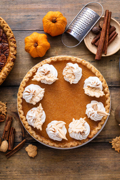istock Traditional Thanksgiving pumpkin pie topped with whipped cream 1443990697
