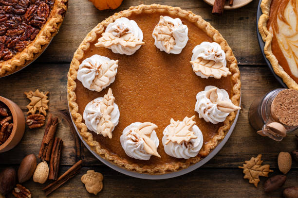 istock Traditional Thanksgiving pumpkin pie topped with whipped cream 1443990701
