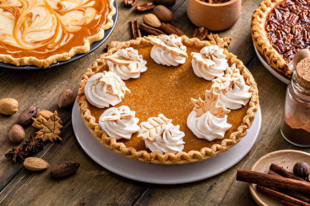 istock Traditional Thanksgiving pumpkin pie topped with whipped cream 1443990705