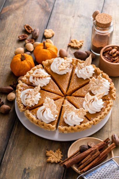 istock Traditional Thanksgiving pumpkin pie cut into slices 1443990716