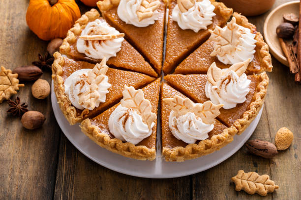 istock Traditional Thanksgiving pumpkin pie cut into slices 1443990717