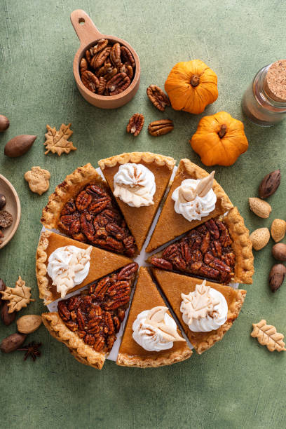istock Traditional fall Thanksgiving pie slices, pumpkin and pecan pie 1443990724