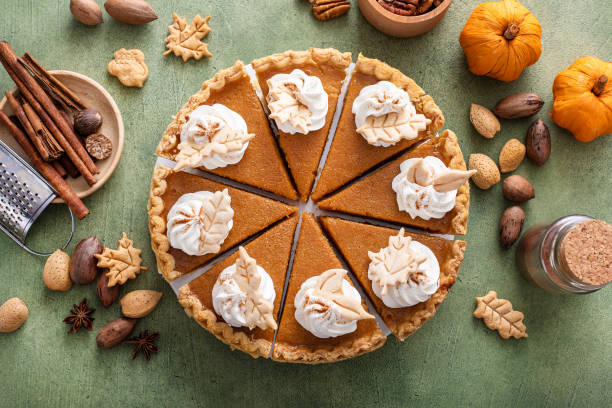 istock Traditional Thanksgiving pumpkin pie cut into slices 1443990727