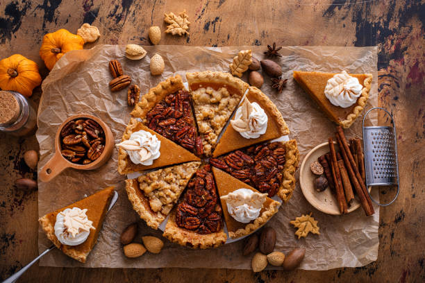 istock Traditional fall Thanksgiving pie slices, pumpkin and pecan pie 1443990732