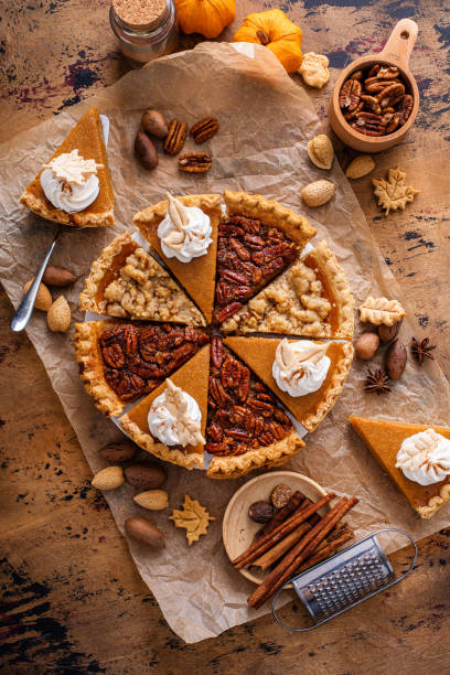 istock Traditional fall Thanksgiving pie slices, pumpkin and pecan pie 1443990734