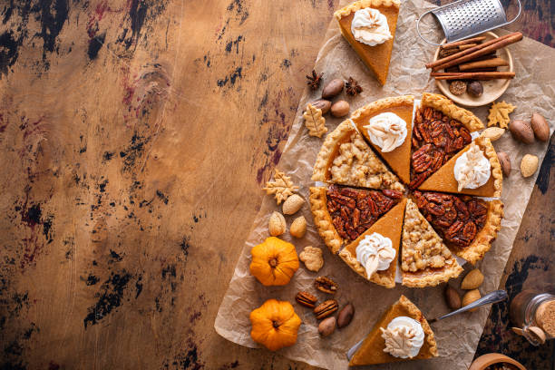 istock Traditional fall Thanksgiving pie slices, pumpkin and pecan pie 1443990735
