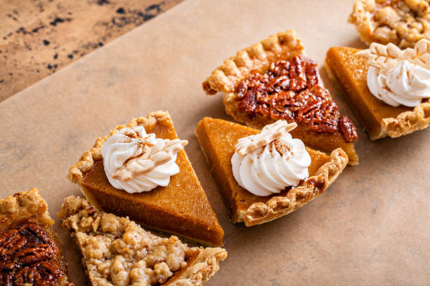 istock Traditional fall Thanksgiving pie slices, pumpkin and pecan pie 1443990737