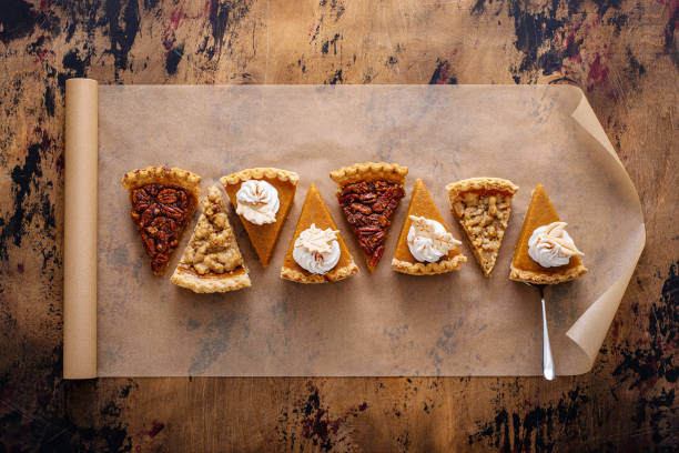istock Variety of fall pie slices on parchment paper 1443990739