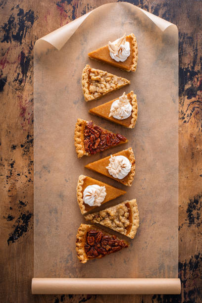 istock Traditional fall Thanksgiving pie slices, pumpkin and pecan pie 1443990740