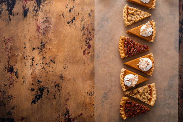 istock Traditional fall Thanksgiving pie slices, pumpkin and pecan pie 1443990744