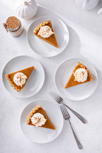 istock Slices of traditional pumpkin pie in a light and bright setting 1443990756