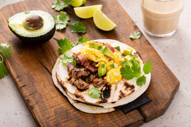 istock Breakfast tacos with sausage, eggs, bacon and avocado 1443991776