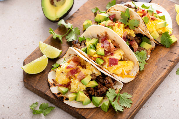istock Breakfast tacos with sausage, eggs, bacon and avocado 1443991789