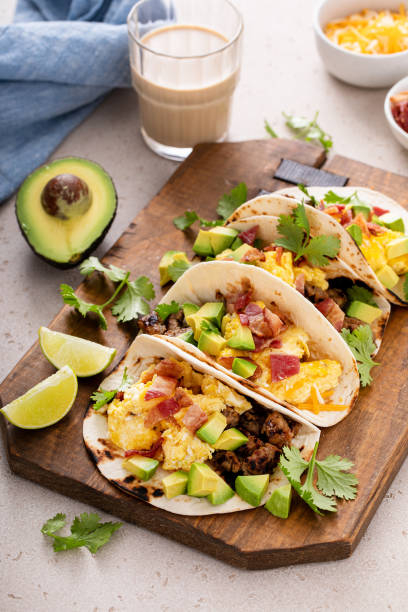 istock Breakfast tacos with sausage, eggs, bacon and avocado 1443991790