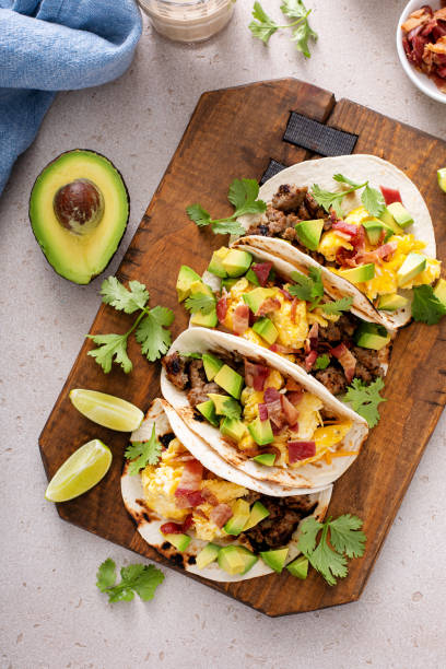 istock Breakfast tacos with sausage, eggs, bacon and avocado 1443991808