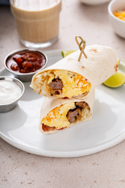 istock Breakfast burrito with sausage, eggs, hashbrown and cheese 1443991822