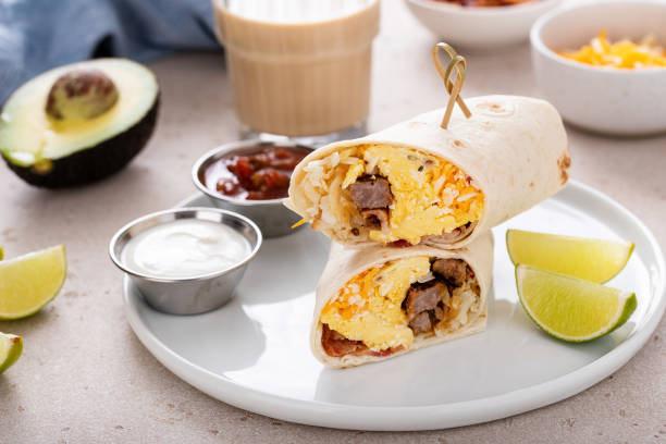 istock Breakfast burrito with sausage, eggs, hashbrown and cheese 1443991830