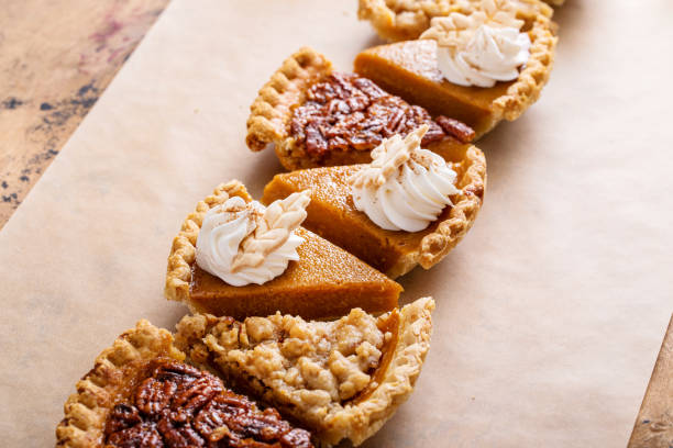 istock Traditional fall Thanksgiving pie slices, pumpkin and pecan pie 1443991903