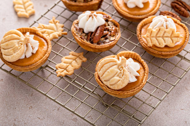 istock Mini pumpkin and pecan pies baked in muffin tin 1443991992