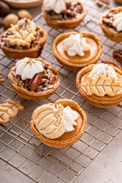 istock Mini pumpkin and pecan pies baked in muffin tin 1443991997